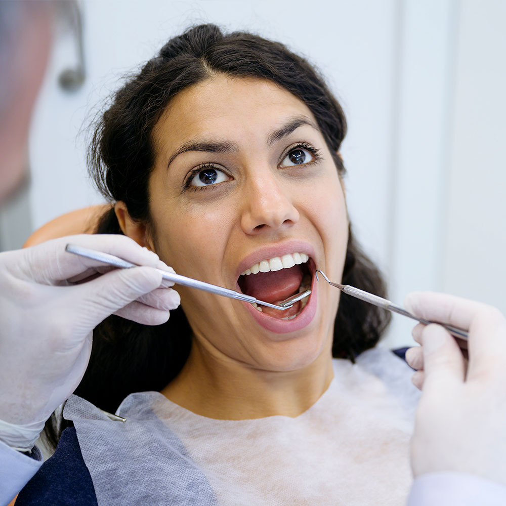 Emergency crown repair exam in Downey